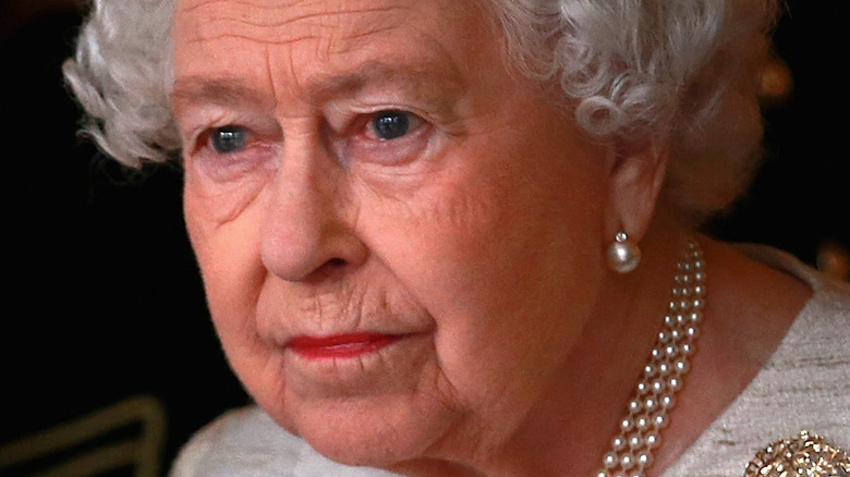 Queen Elizabeth II preparing to greet Kazakhstan President Nursultan Nazarbayev