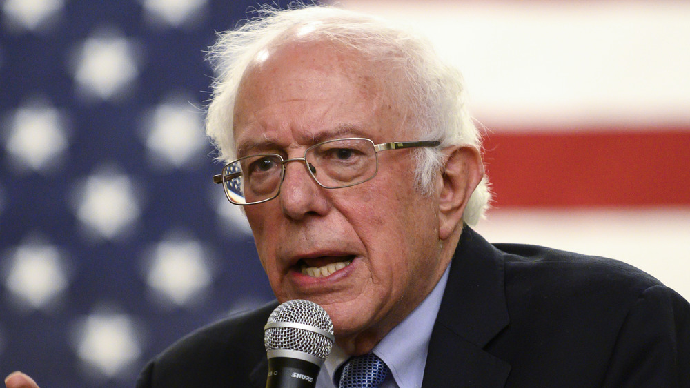 Bernie Sanders talking into a microphone