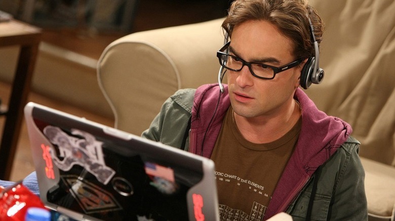 Leonard with a headset on using his computer on The Big Bang Theory