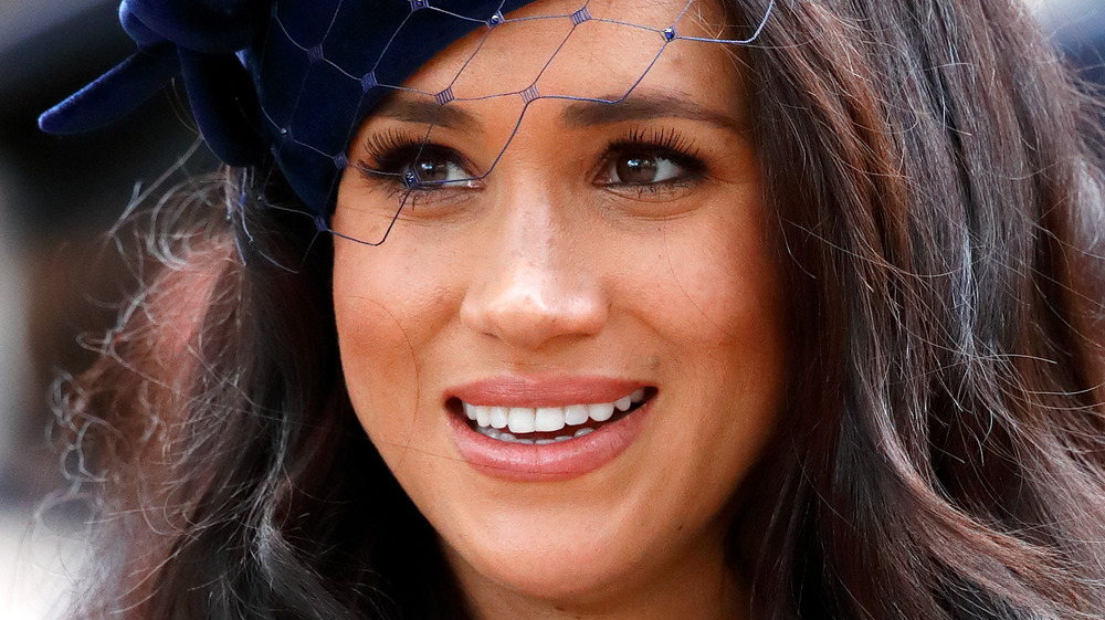 Meghan Markle wears a blue hat