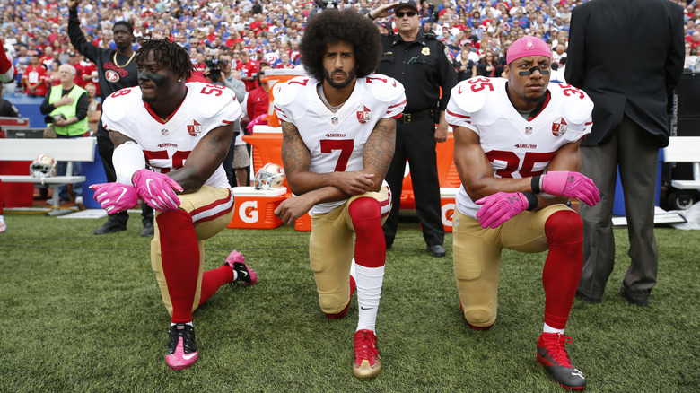 Colin Kaepernick kneels alongside other SF players