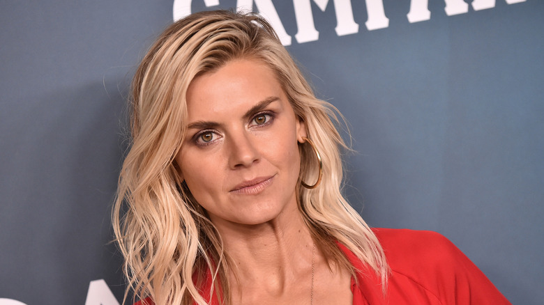 Eliza Coupe poses in red dress