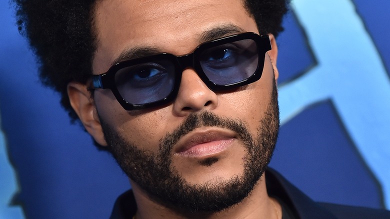 The Weeknd poses in 2022