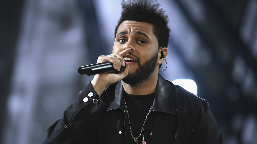 The Weeknd performing on stage at a concert