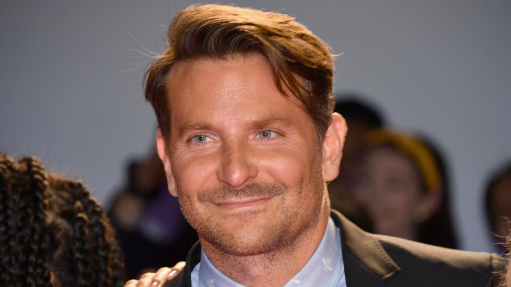 Bradley Cooper smirking off-camera