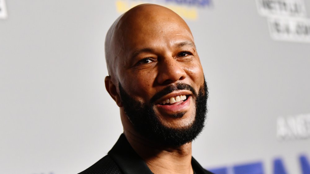 Common smiling on the red carpet 