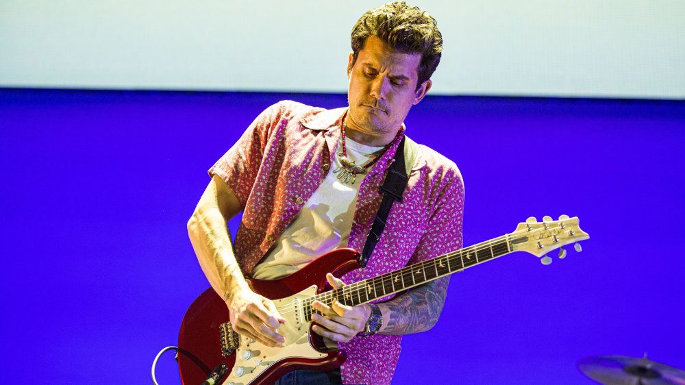 John Mayer performing on stage