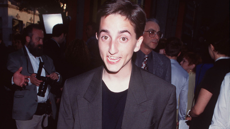 Charlie Korsmo poses for a photo at an event