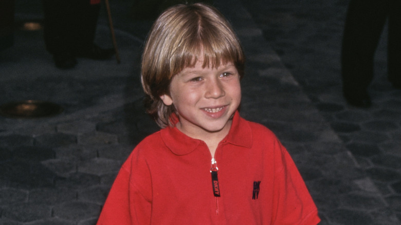 Young Justin Cooper smiling
