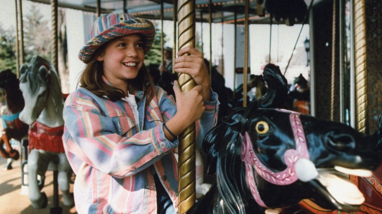 Young Liesel Matthews on a merry-go-round