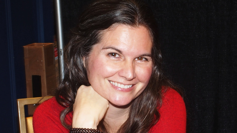 Lisa Jakub poses for a photo in red