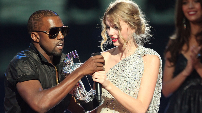Kanye West grabbing Taylor Swift's microphone