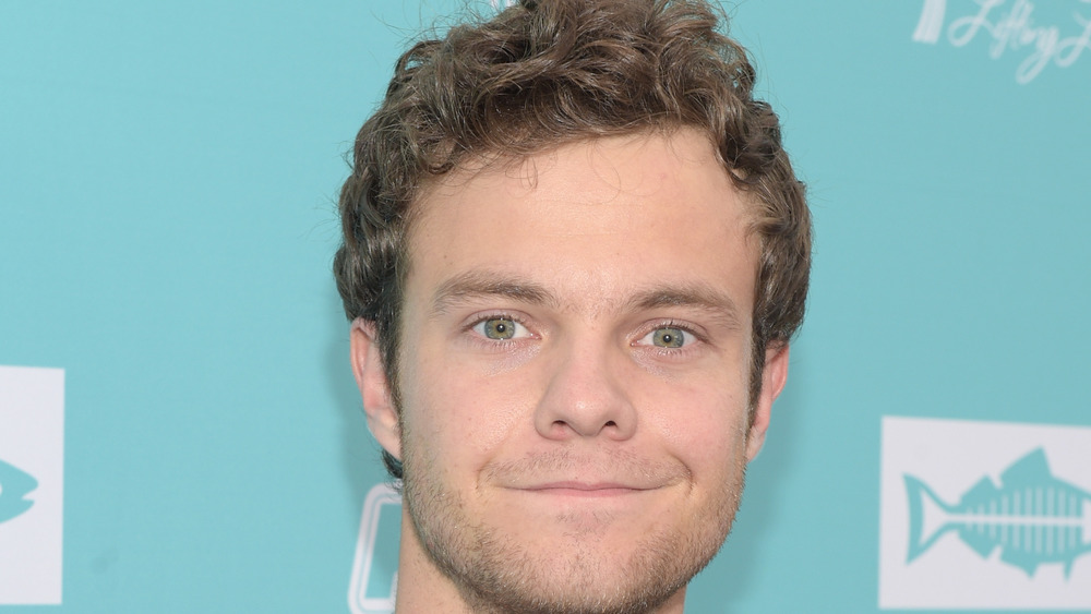 Jack Quaid staring