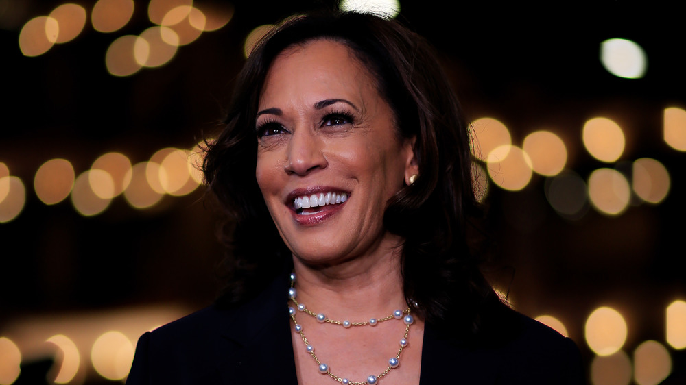 Vice President Kamala D. Harris smiling with pearls