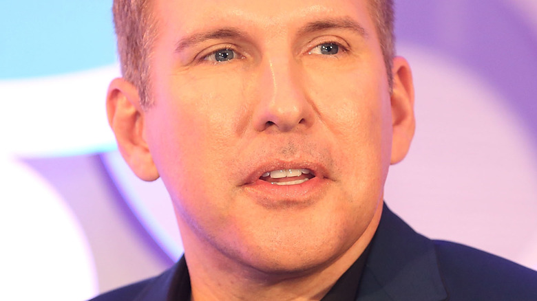Todd Chrisley looking to the left onstage