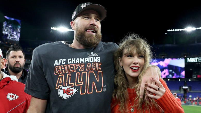 Travis Kelce and Taylor Swift smiling