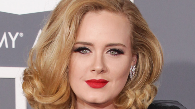 Adele smiles in red lipstick