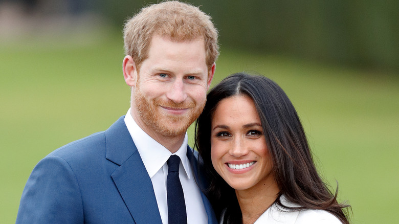 Prince Harry and Meghan Markle smiling