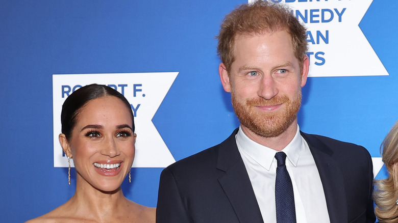 Prince Harry and Meghan Markle smiling