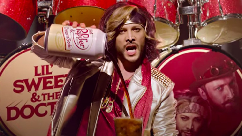 Justin Guarini pouring a Dr. Pepper