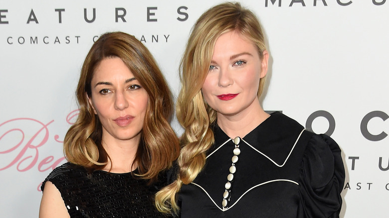Sofia Coppola and Kirsten Dunst at event black dress posing