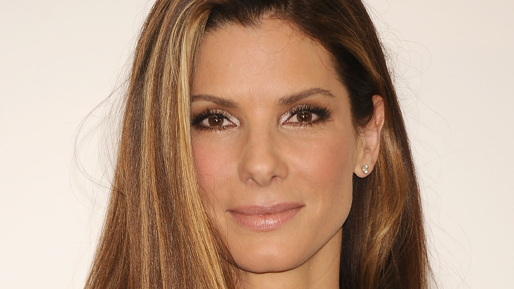 Sandra Bullock smiles on the red carpet for the premiere of The Proposal in 2009