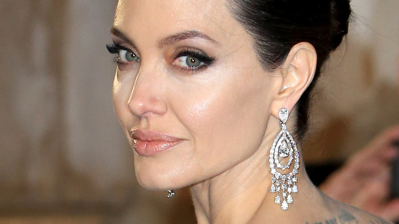 Angelina Jolie over the shoulder smile 