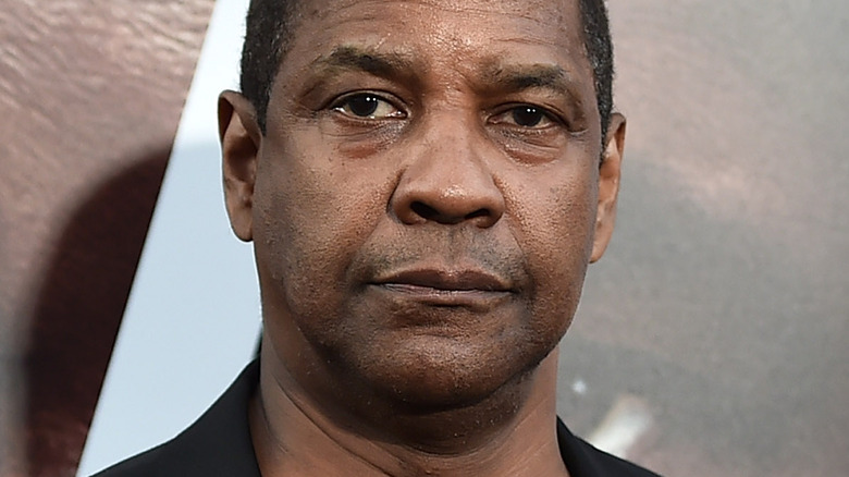 Denzel Washington looking serious on the red carpet