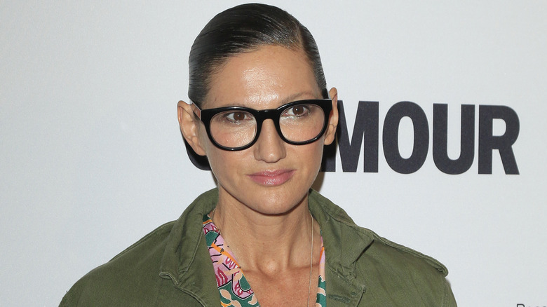 Jenna Lyons green jacket black glasses