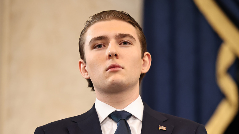 Barron Trump looks on