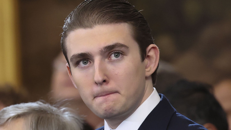 Barron Trump looks on