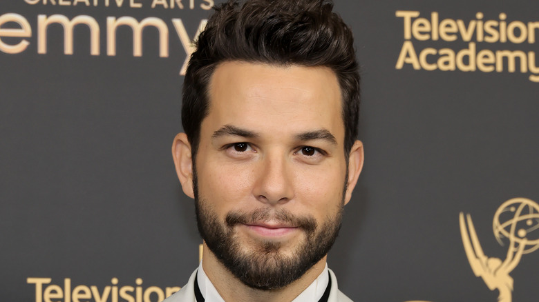 Skylar Astin posing