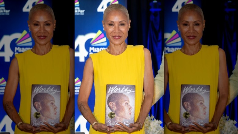 Jada Pinkett Smith holding her book Worthy