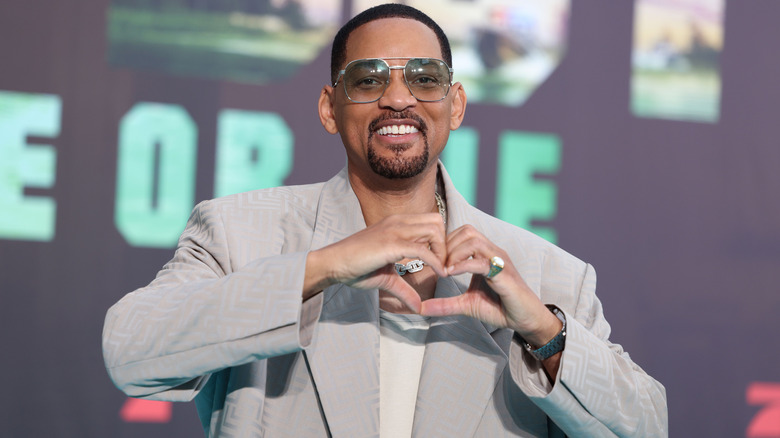 Will Smith signalling a heart at Bad Boys: Ride or Die press tour