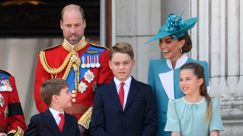 Prince William and Kate Middleton look awkward with their children on the balcony of Buckingham Palace