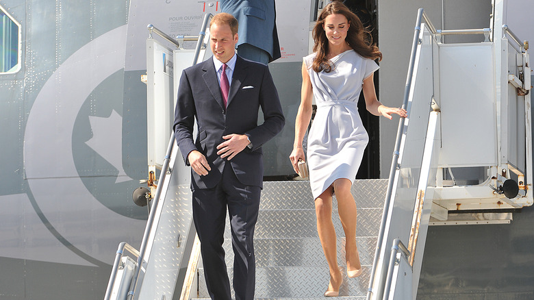 Prince William and Kate Middleton deboarding jet