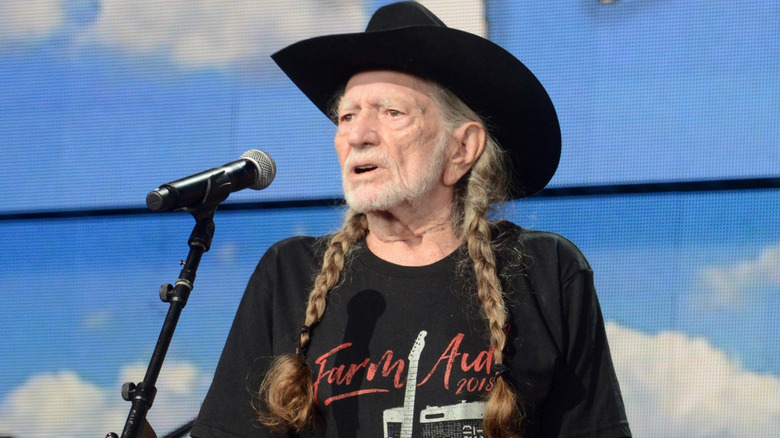 Willie Nelson performing at Farm Aid