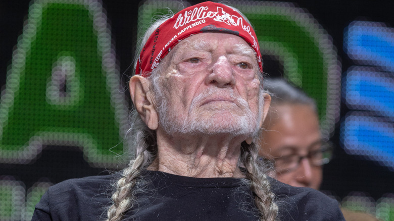 Country music star Willie Nelson wearing a red bandana