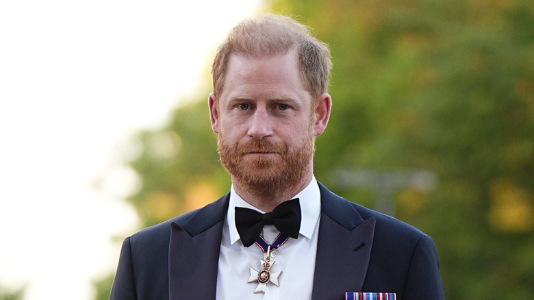 Up-close photo of Prince Harry in a black and white suit in September 2026.
