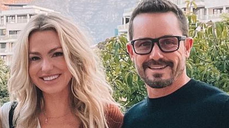 Trish Lynn Mears and Casey Mears smiling while standing beside one another outside