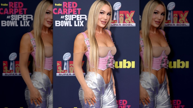 Jamie Hauptmann wearing silver jeans and a bustier