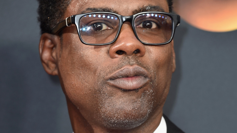 Chris Rock smirking