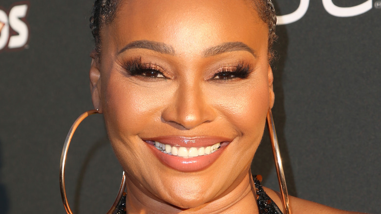 Cynthia Bailey wearing gold hoop earrings