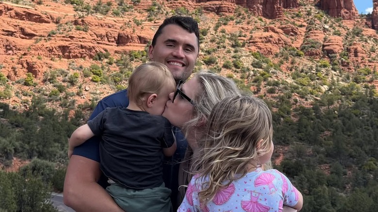 Erika and Charlie Kirk pose with their two children