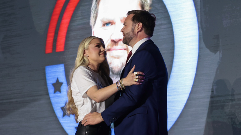 Erika Kirk and JD Vance before they embrace in October 2025