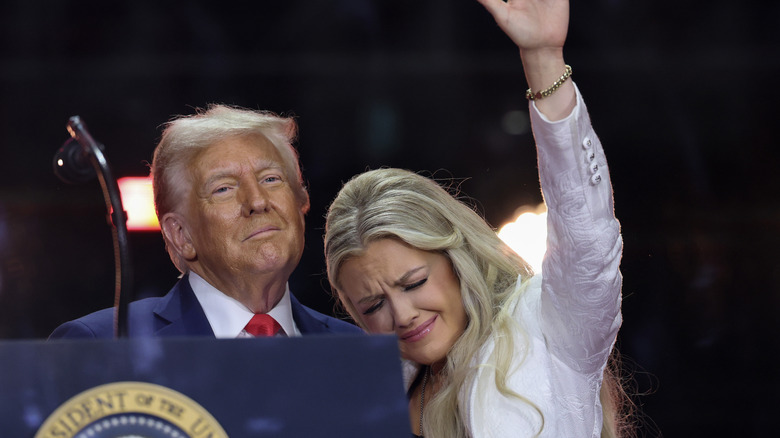 Erika Kirk hugs Donald Trump at memorial service for Charlie Kirk