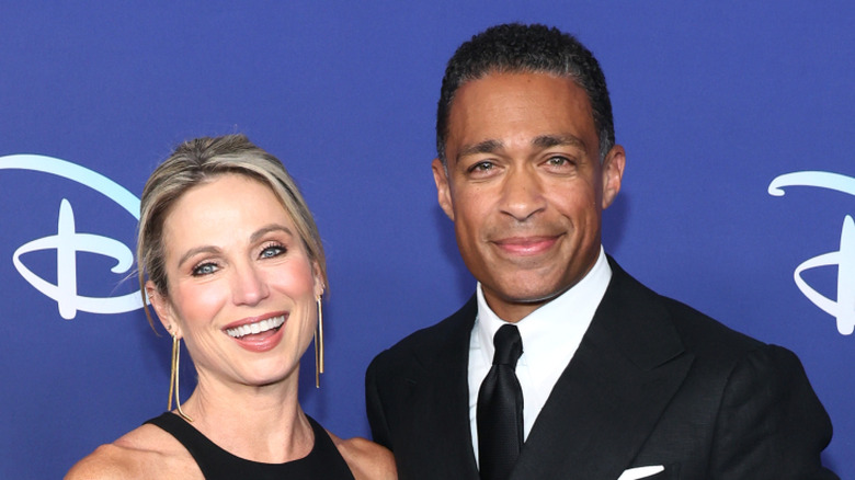 Amy Robach and T.J. Holmes smiling