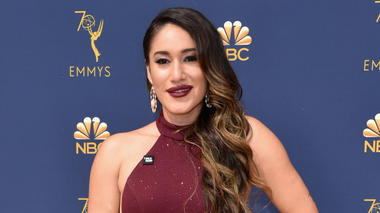 Q'orianka Kilcher poses on the Emmy's red carpet