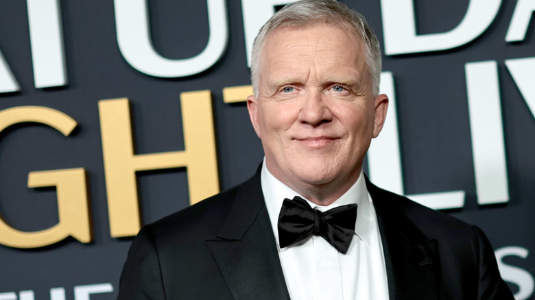 Anthony Michael Hall in a tuxedo at the "SNL 50" red carpet