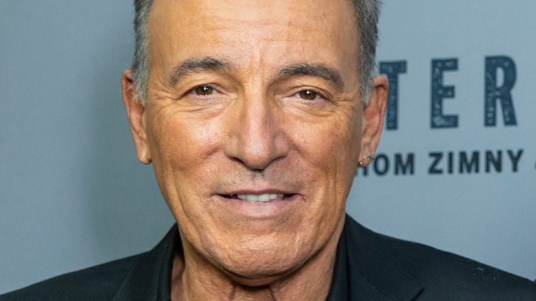 Bruce Springsteen smiles on red carpet